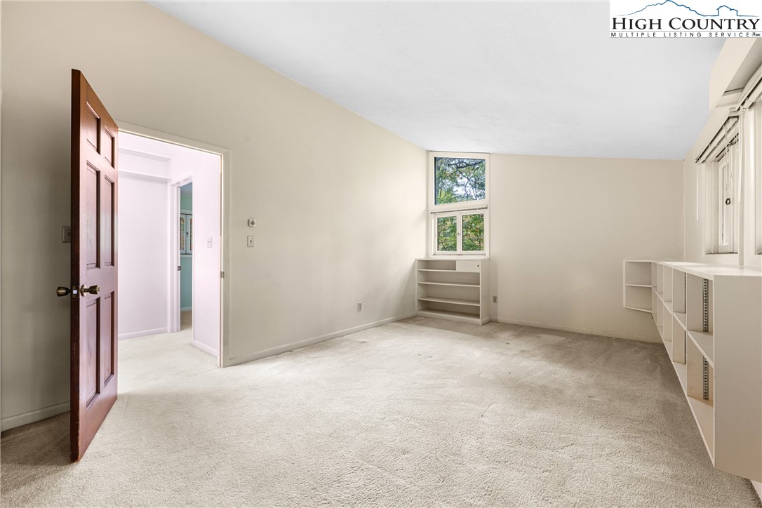 547 Deck Hill Road Boone, NC 28607 - Photo 31 of 50 a view of an empty room with a window