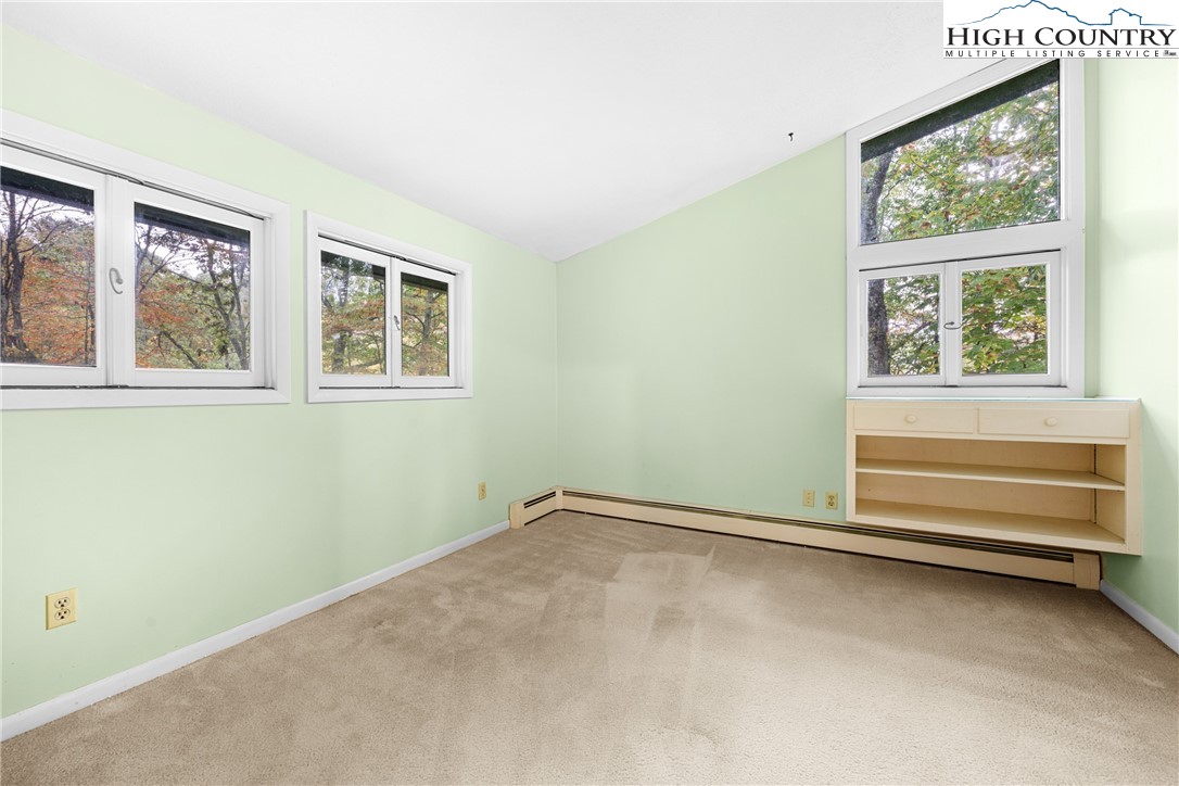 547 Deck Hill Road Boone, NC 28607 - Photo 33 of 50 an empty room with windows