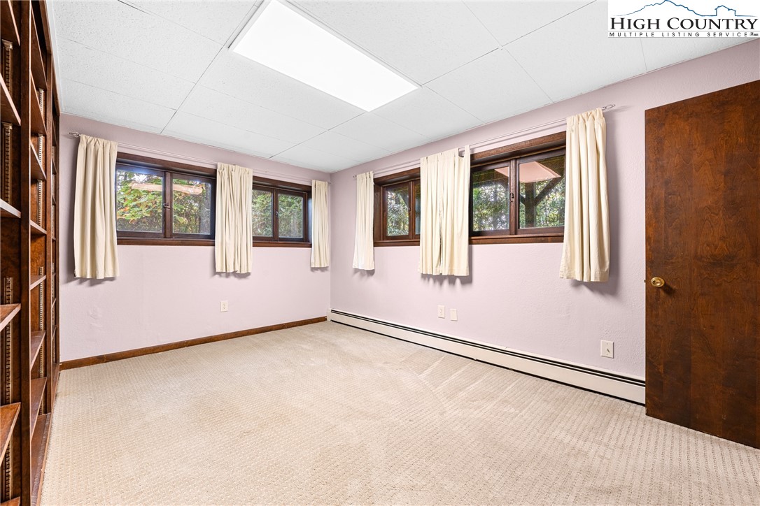 547 Deck Hill Road Boone, NC 28607 - Photo 45 of 50 an empty room with windows