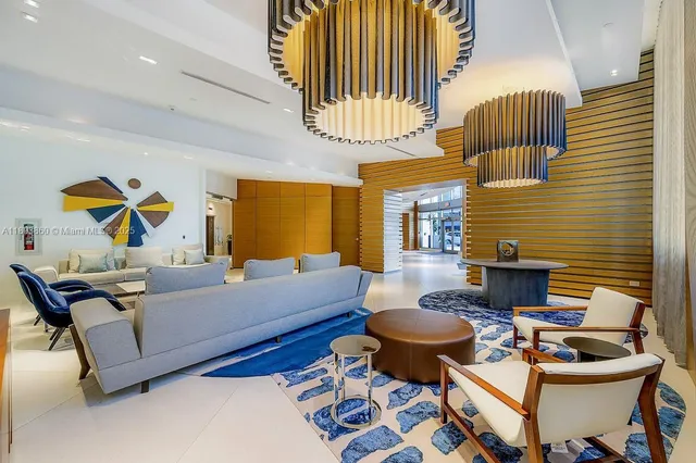 a living room with furniture and a lamp