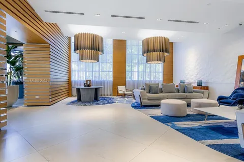 a living room with furniture wooden floor and a table