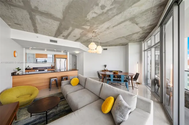 a large kitchen with a table and chairs