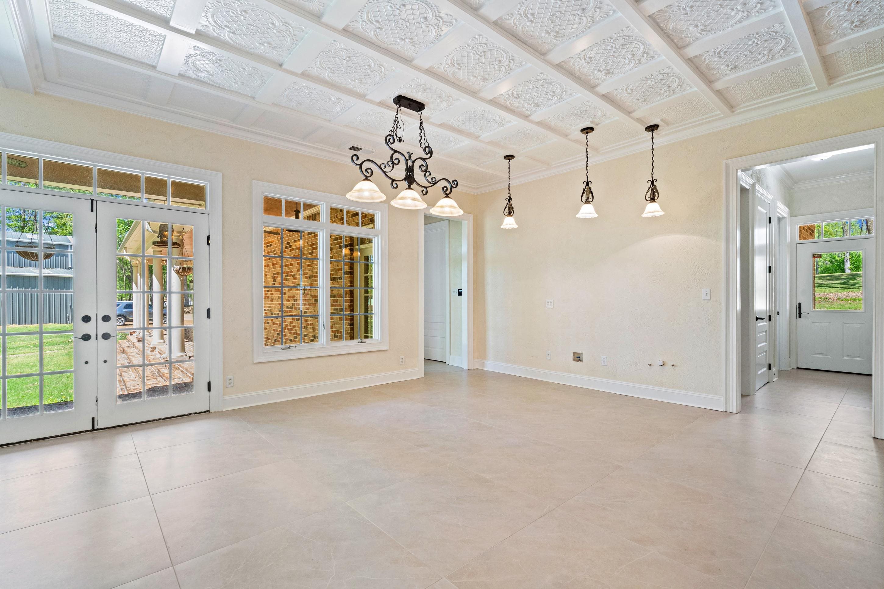 815 Dent Road Eads, TN 38028 - Photo 18 of 40 Empty room featuring crown molding and french doors