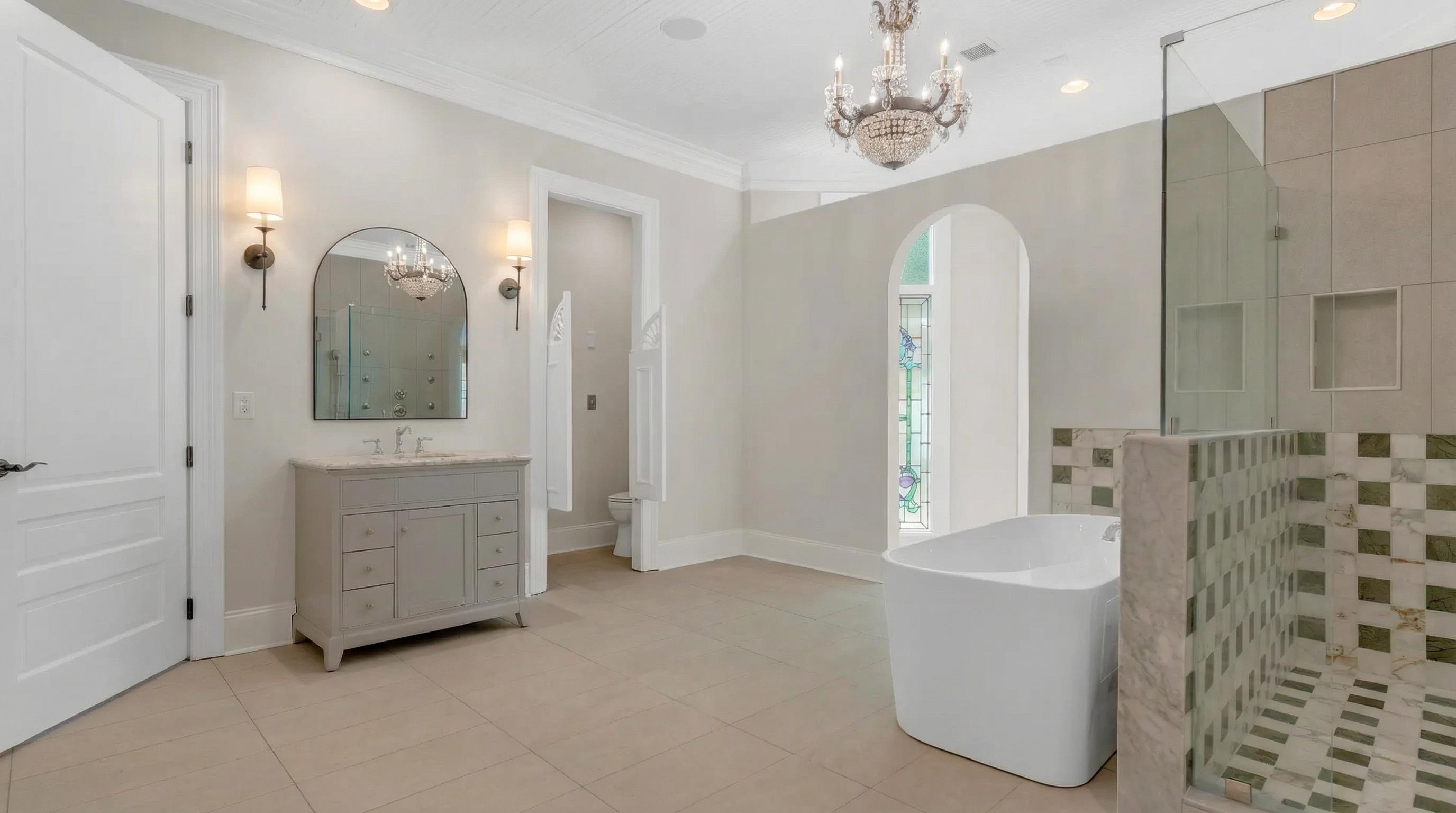 815 Dent Road Eads, TN 38028 - Photo 25 of 40 Full bath featuring suspended lighting, a walk in shower, light tile patterned floors, vanity, and crown molding