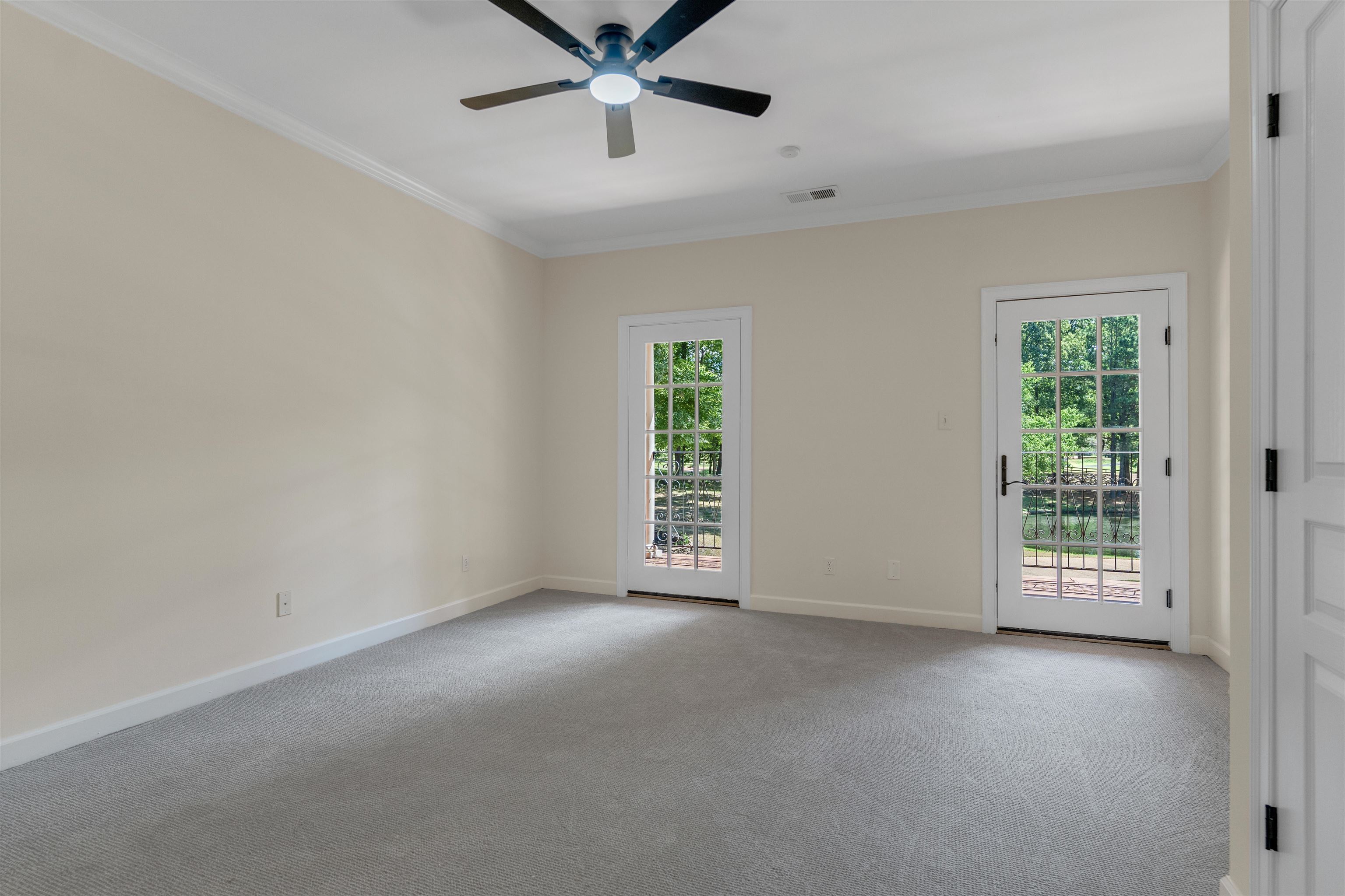 815 Dent Road Eads, TN 38028 - Photo 33 of 40 Spare room with plenty of natural light, ornamental molding, light carpet, and ceiling fan