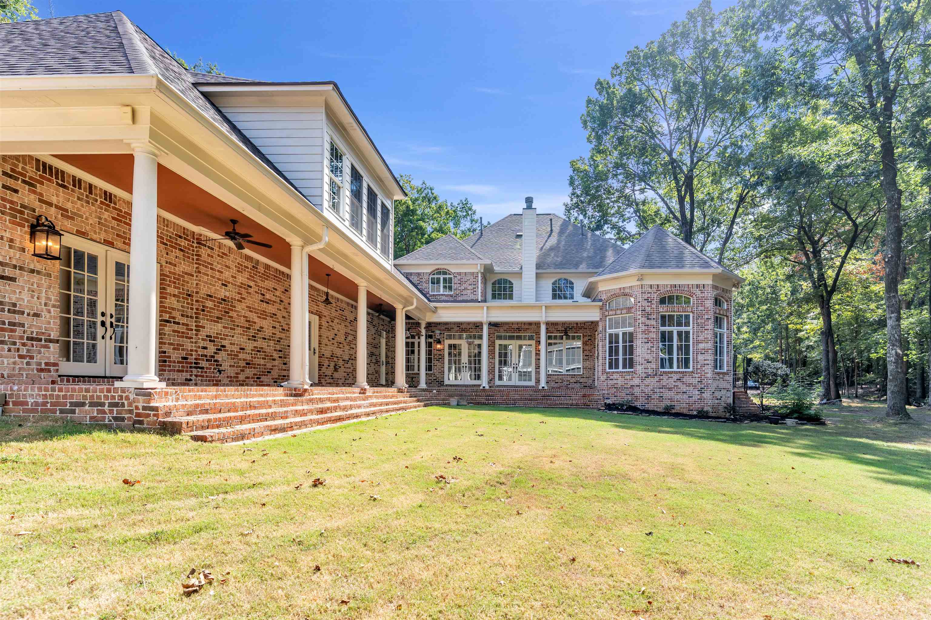 815 Dent Road Eads, TN 38028 - Photo 38 of 40 Rear view of house with a ceiling fan, brick siding, a yard, and french doors