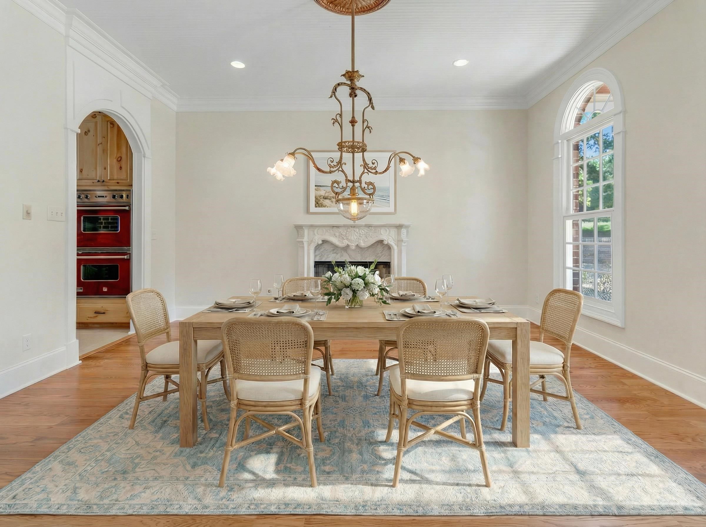 815 Dent Road Eads, TN 38028 - Photo 8 of 40 Dining space with light wood-type flooring, ornamental molding, a chandelier, arched walkways, and a high end fireplace