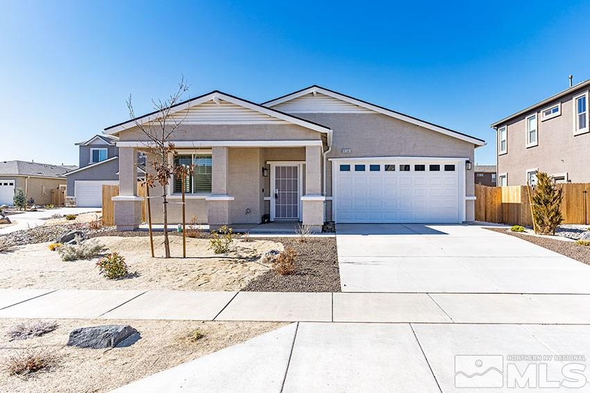 9260 Peninsula Court Reno, NV 89506 - Photo 1 of 25 a front view of a house with a yard