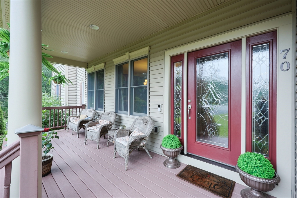 70 Azalea Way Hanson, MA 02341 - Photo 6 of 42 a balcony with furniture and wooden floor