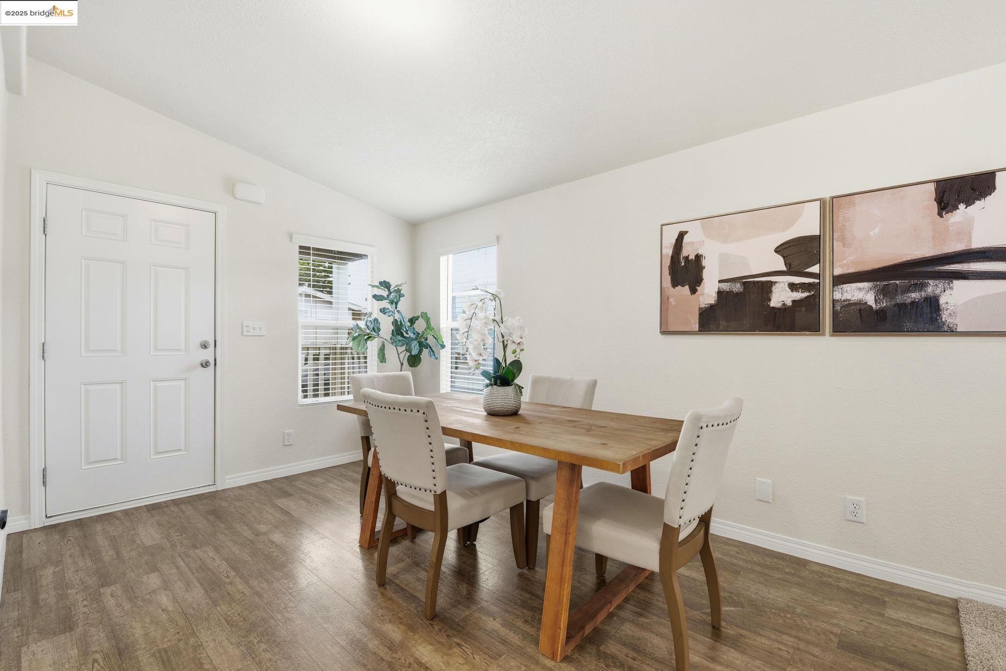16711 Marsh Creek Road, Unit 111 Clayton, CA 94517 - Photo 17 of 34 a view of a dining room with furniture and wooden floor