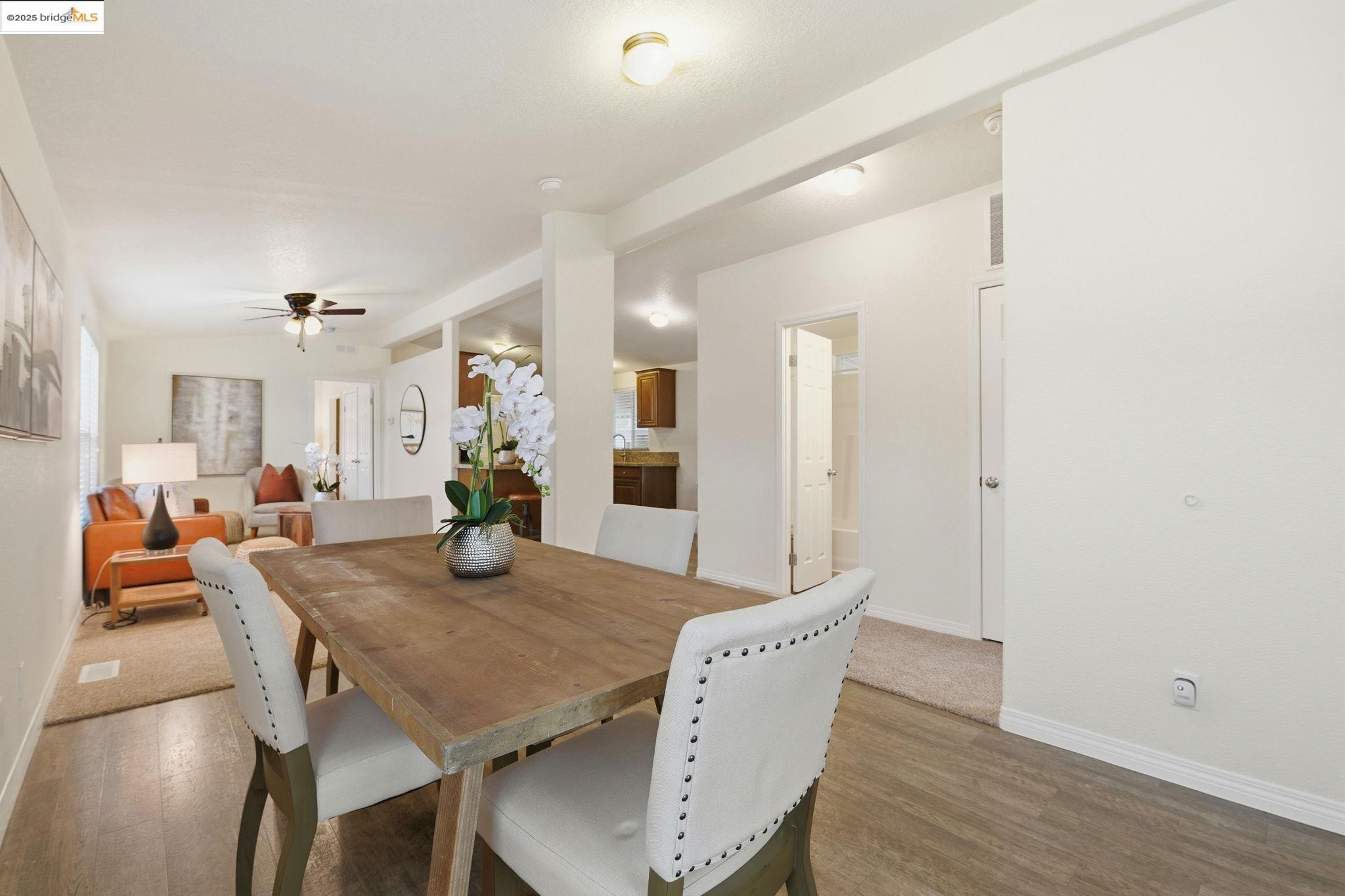 16711 Marsh Creek Road, Unit 111 Clayton, CA 94517 - Photo 18 of 34 a view of a dining room with furniture and wooden floor