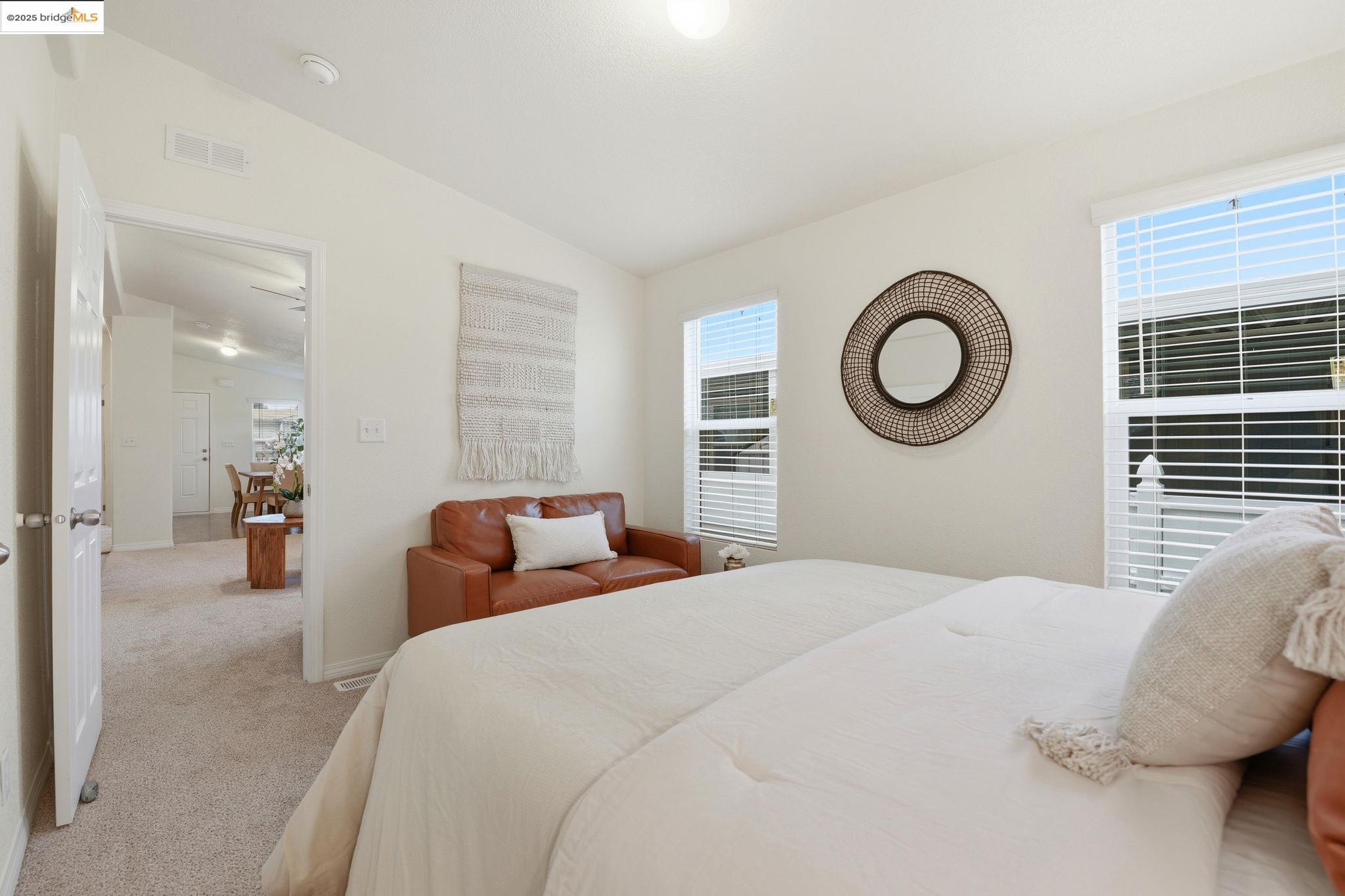 16711 Marsh Creek Road, Unit 111 Clayton, CA 94517 - Photo 25 of 34 a bedroom with a bed and a chandelier