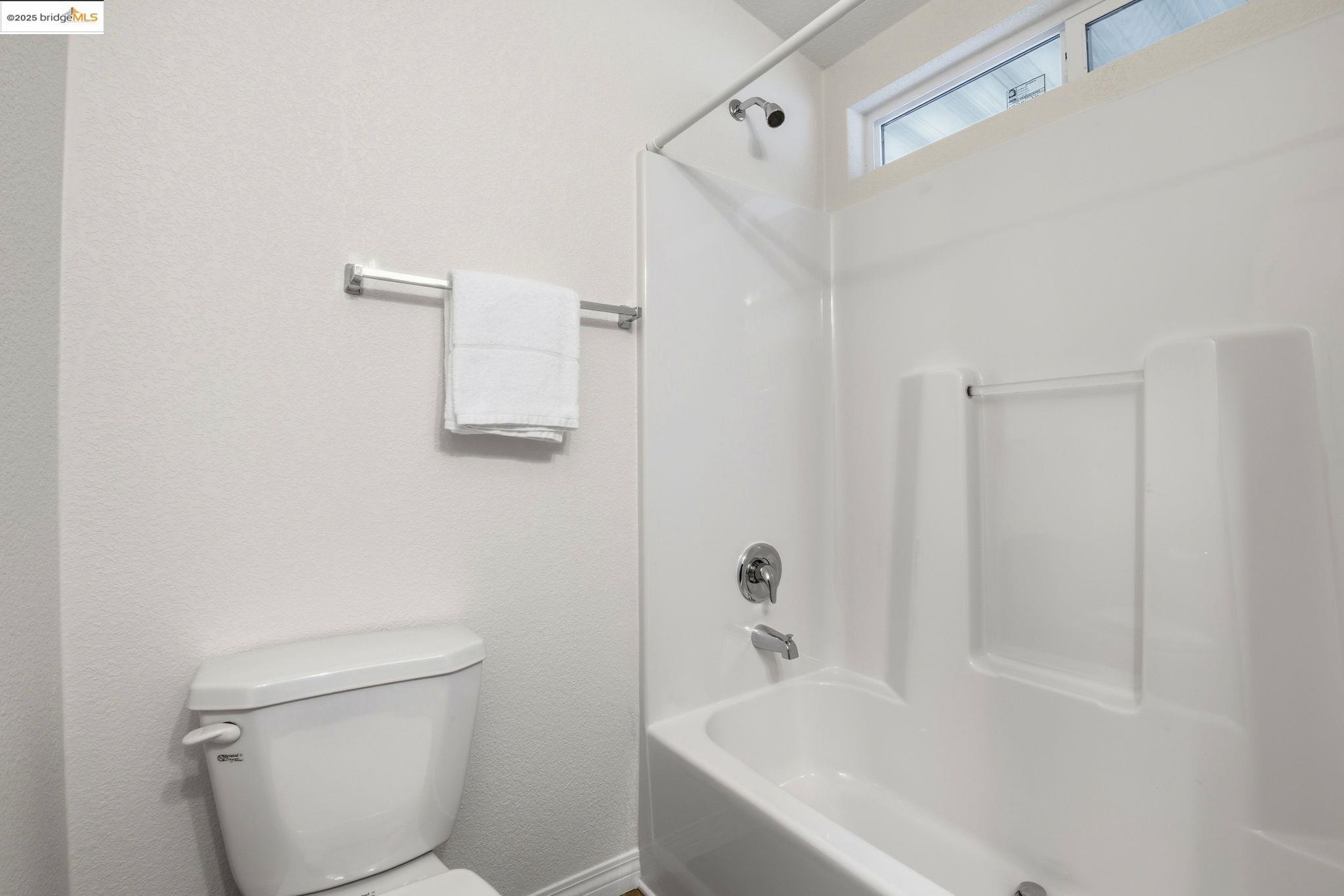 16711 Marsh Creek Road, Unit 111 Clayton, CA 94517 - Photo 28 of 34 a white bath tub sitting next to a white toilet