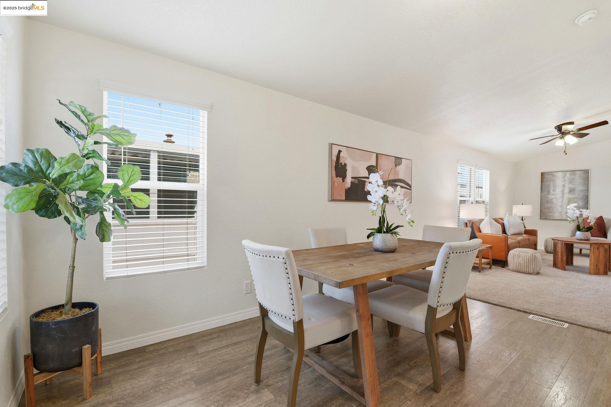 16711 Marsh Creek Road, Unit 111 Clayton, CA 94517 - Photo 5 of 34 a view of a dining room with furniture and a potted plant