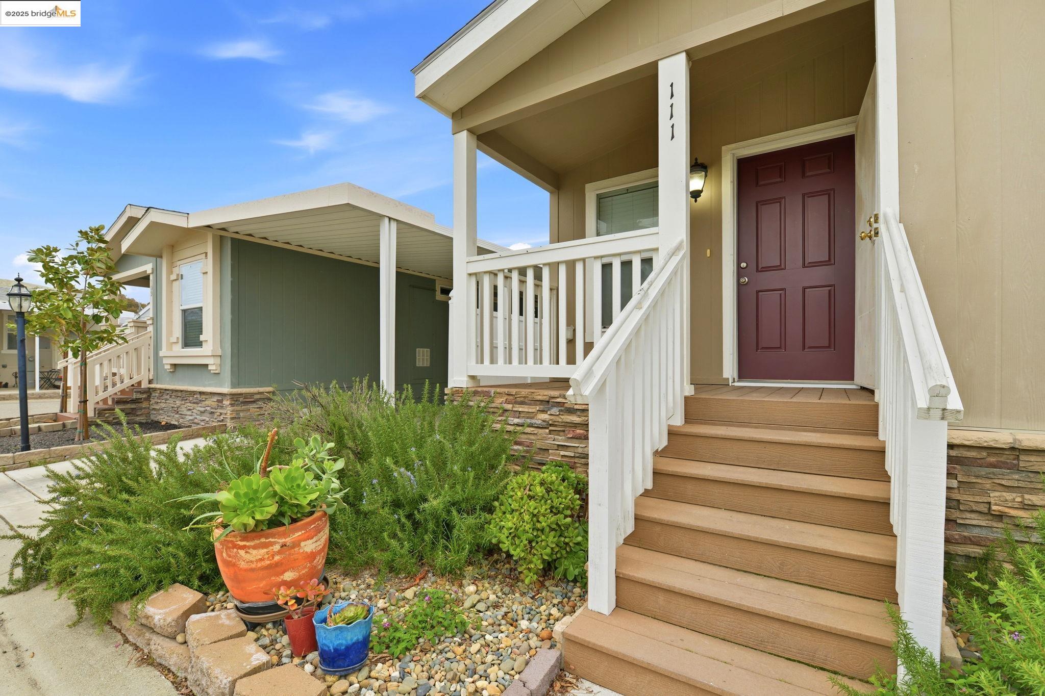 16711 Marsh Creek Road, Unit 111 Clayton, CA 94517 - Photo 8 of 34 a view of a house with wooden floor and potted plants