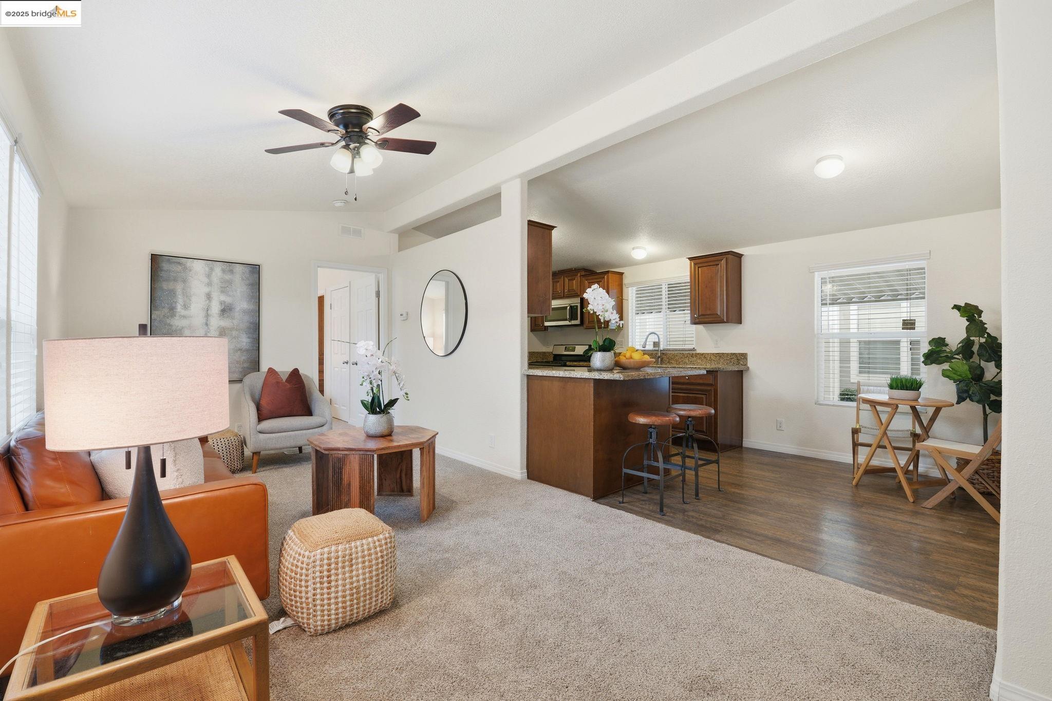 16711 Marsh Creek Road, Unit 111 Clayton, CA 94517 - Photo 9 of 34 a living room with furniture and wooden floor