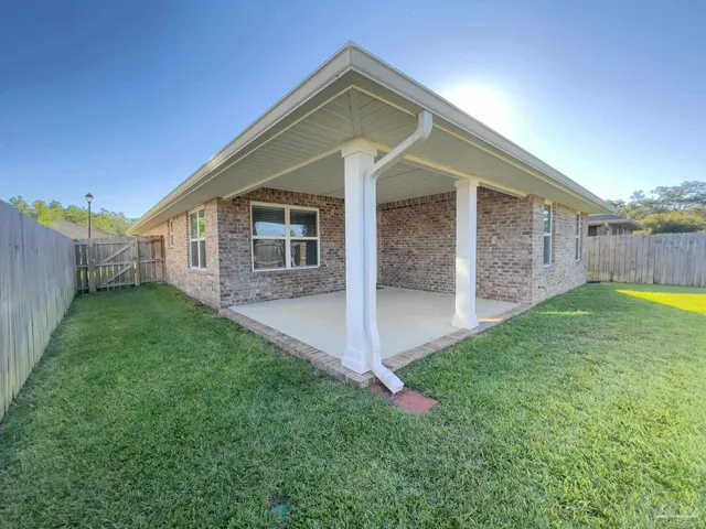 a view of a back yard of the house