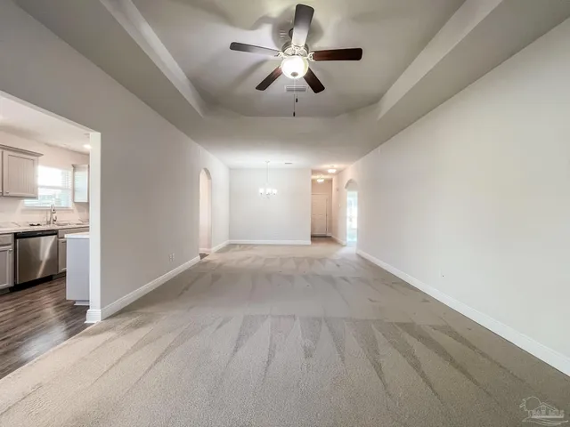 a view of a livingroom with a kitchen