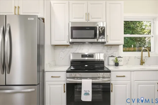 a bedroom with bed and a potted plant