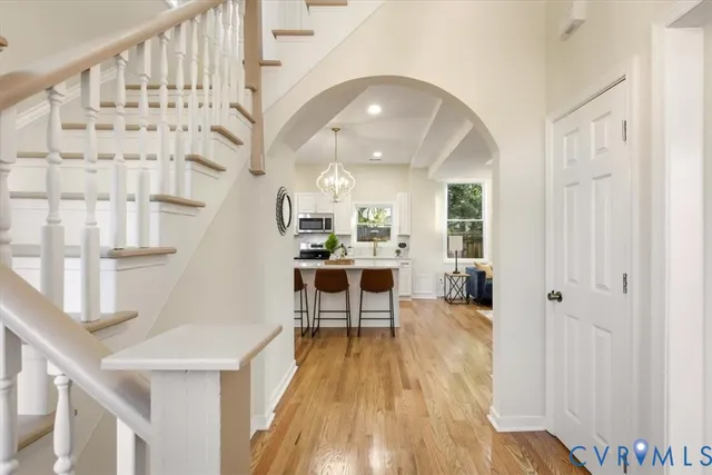 a lobby with furniture and wooden floor