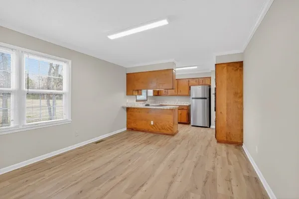 a view of kitchen with wooden floor