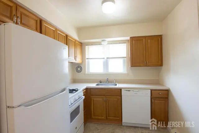 a utility room with a sink a washer and dryer