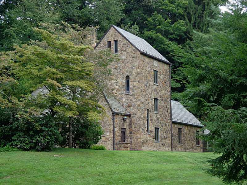 Exterior Front. Welcome to the Valley Tower. This landmark home was built in 1939 by renowned architect Henry Hornbostel. It has stunning stone work and a beautiful slate roof that was installed by the current owners.