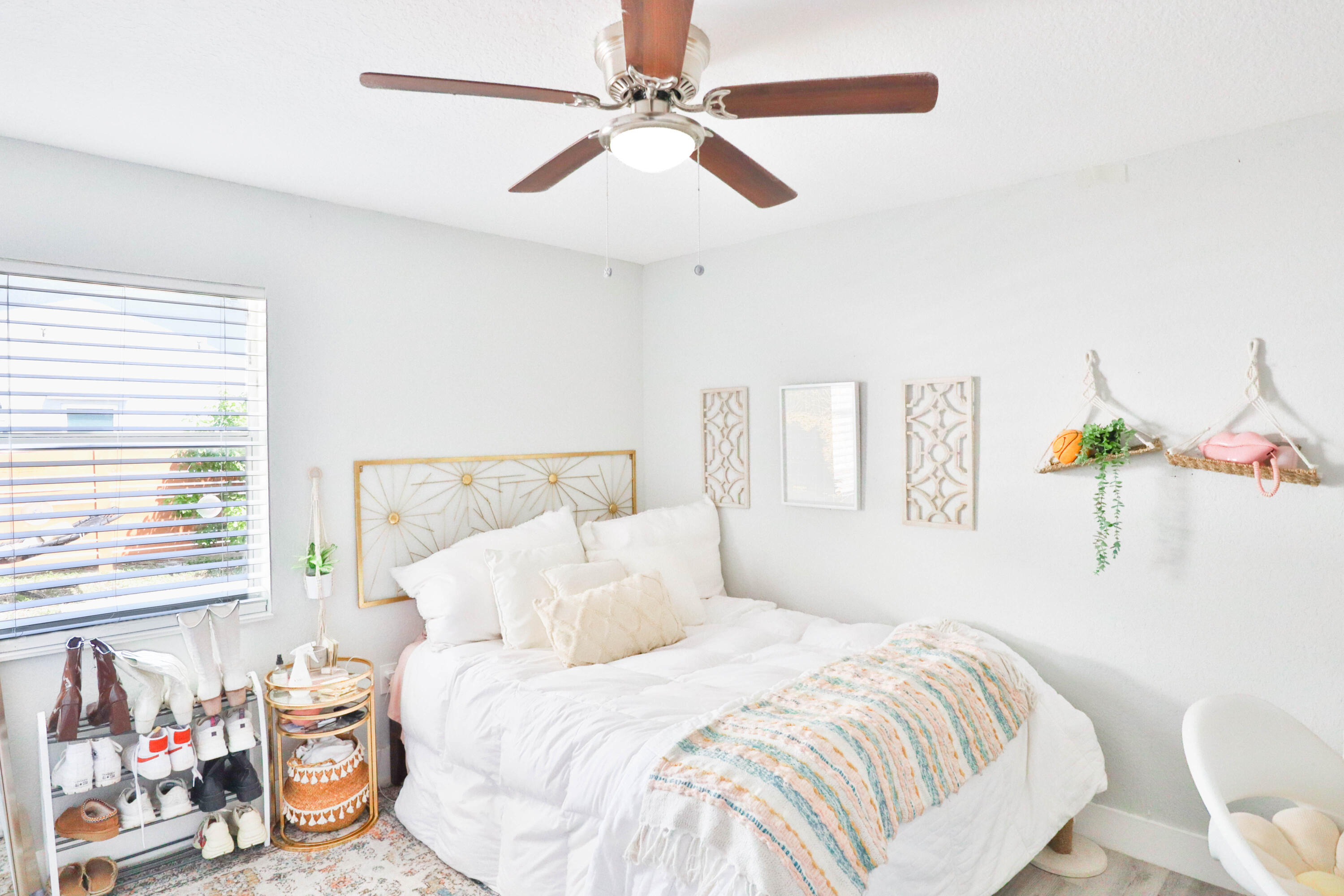 6120 North Dixie Highway Boca Raton, FL 33487 - Photo 4 of 25 a bedroom with a bed a window and a chandelier