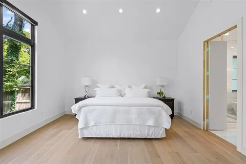 a bedroom with a bed and window