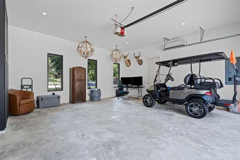 a view of a livingroom with furniture and a large window