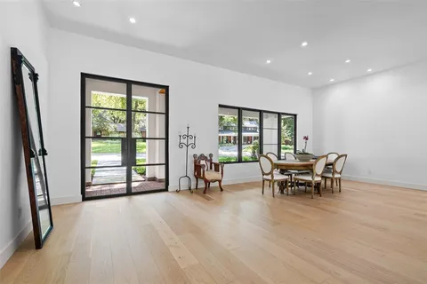 a view of a work space with wooden floor and furniture