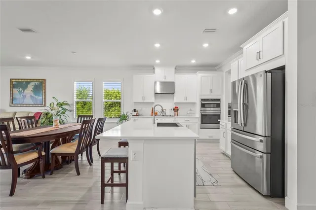 a view of a dining room with furniture window and outside view