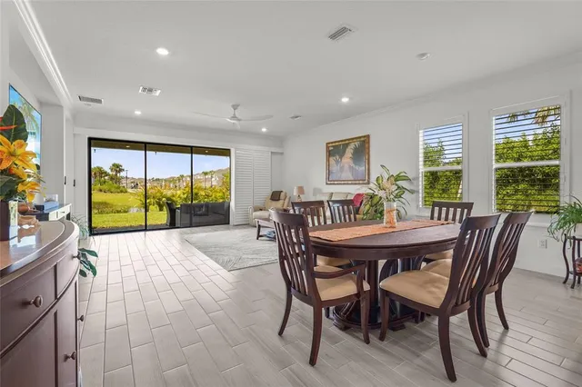 a view of a livingroom with furniture window wooden floor and front door