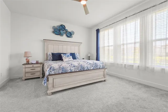 a view of a kitchen cabinets and a window