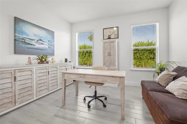 an aerial view of residential houses with outdoor space