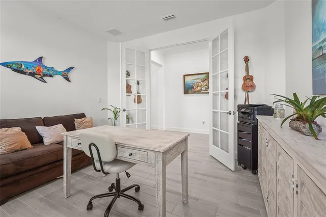 an aerial view of residential houses with outdoor space and street view