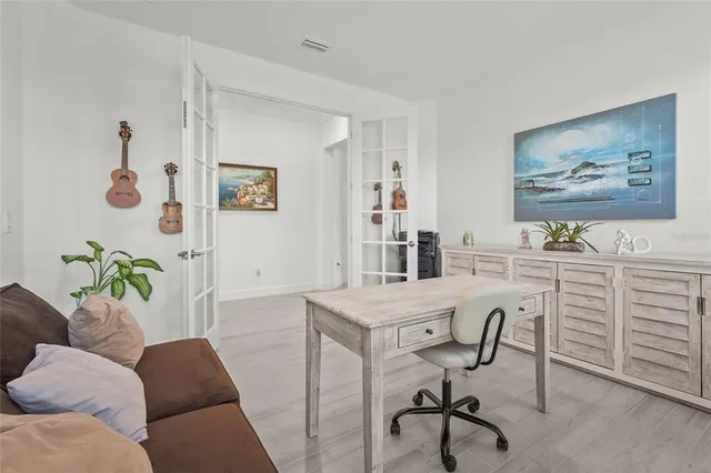 aerial view of a swimming pool with outdoor seating and yard