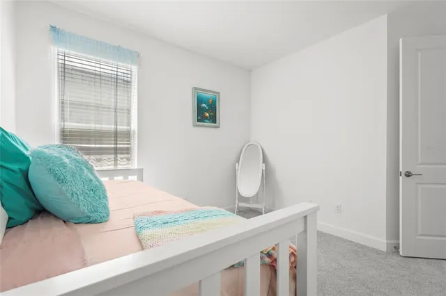 a view of a swimming pool with a garden and trees