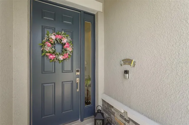 a kitchen with white cabinets and appliances