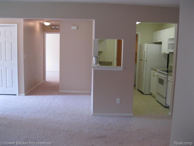 3384 Tremonte Circle, Unit 178 Rochester, MI 48306 - Photo 11 of 37 From Master Bedroom Across DR to Entry, Guest Room & Kitchen