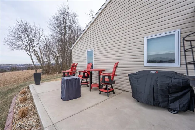 a view of backyard with sitting area