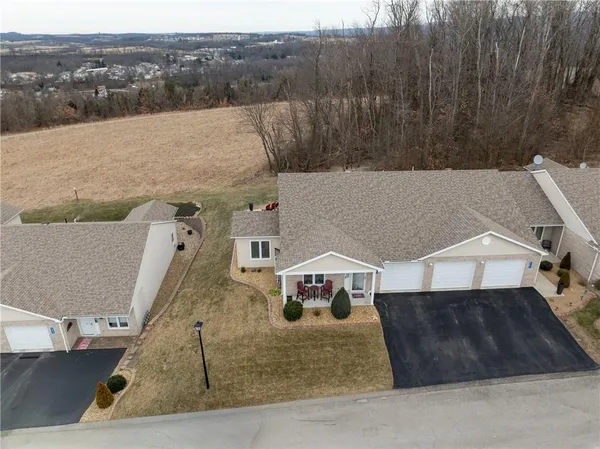 a aerial view of a house with a yard