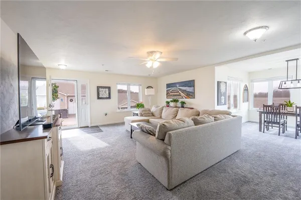 a living room with furniture and a table