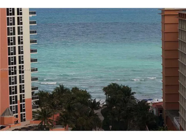 a view of swimming pool and brick wall