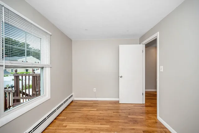 a view of an empty room with glass door
