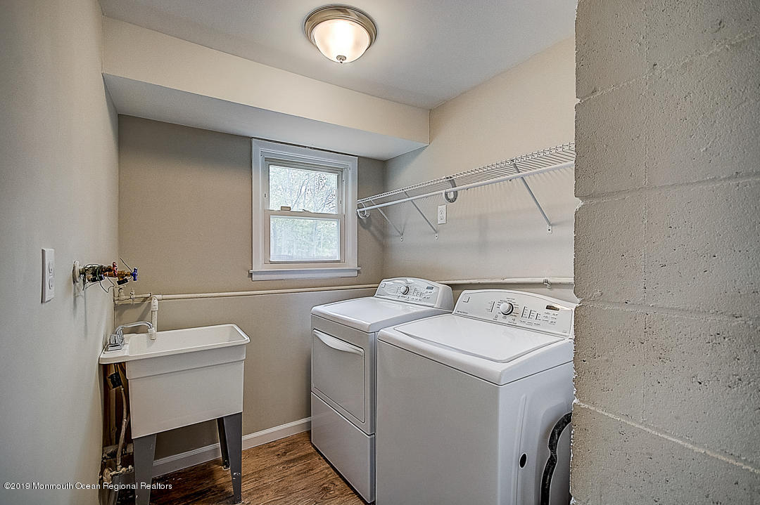 24 Pine Road Howell, NJ 07731 - Photo 20 of 21 a utility room with dryer and washer