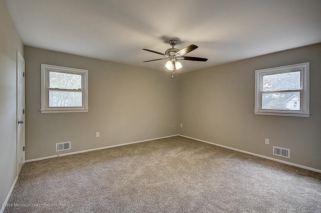 24 Pine Road Howell, NJ 07731 - Photo 8 of 21 a view of an empty room with a window
