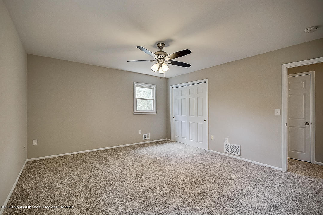 24 Pine Road Howell, NJ 07731 - Photo 9 of 21 a view of an empty room with a window