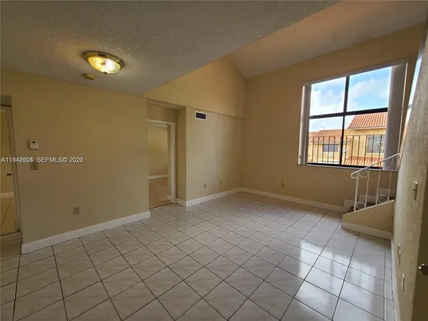 a view of an empty room and window