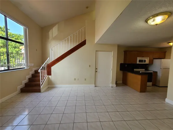 a view of kitchen with furniture and window